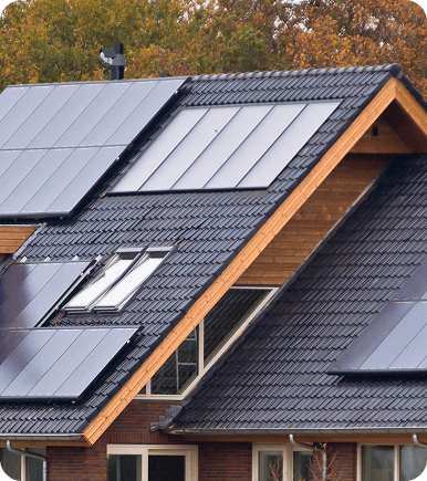 A photo of a house with a roof that has solar panels installed